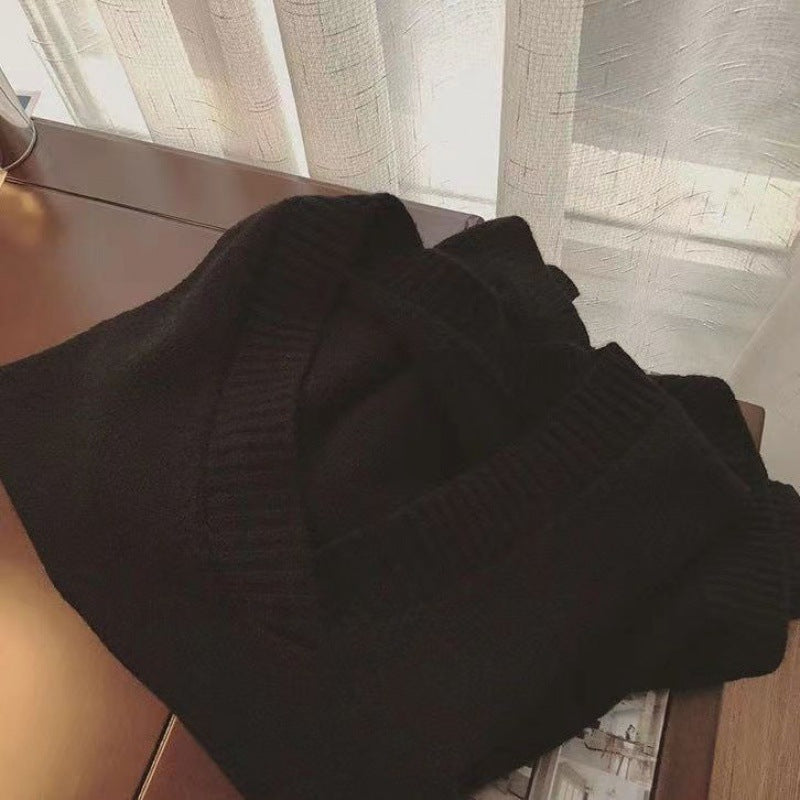 Lison — Pull sans manches à col V et bas fendu — Noir