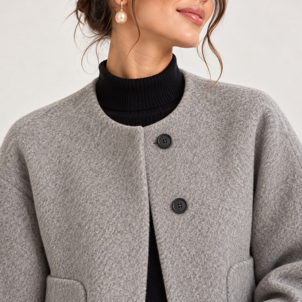 Lucie — Veste ample sans col à poches arrondies — détail et finition